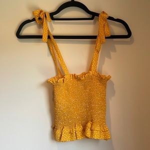 Olivaceous: LA designer yellow polka-dot tank top
